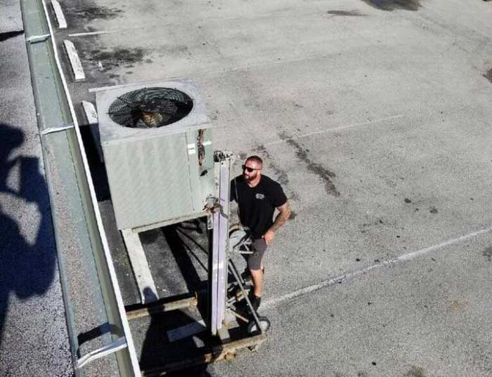 An A/C installation technician.