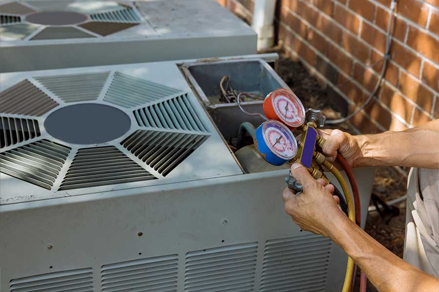 A technician checking an A/C unit.